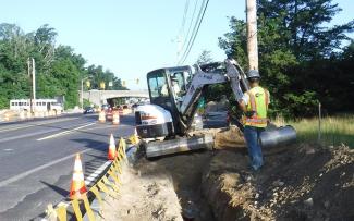 Workers Repairing Drainage