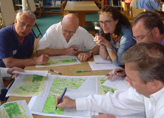 Working group at table with maps